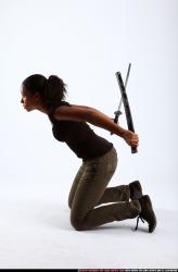 Woman Young Athletic Black Fighting with sword Kneeling poses Casual