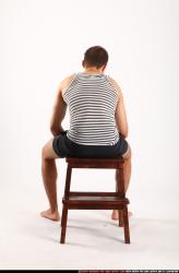 Man Adult Athletic White Neutral Sitting poses Sportswear
