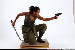 Woman Young Athletic Black Fighting with gun Kneeling poses Army