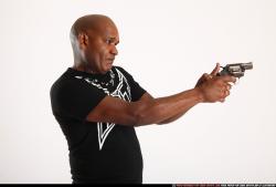 Man Old Chubby Black Fighting with gun Standing poses Casual