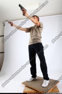 2011 01 PATRICK STANDING DUAL PISTOLS 01 C