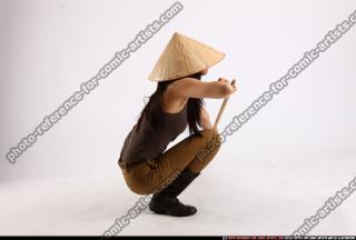 naomi-kneeling-stick-pose