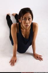Woman Young Athletic Fitness poses Laying poses Sportswear Asian