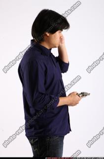 liam-calling-holding-revolver