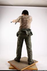 Man Adult Average Fighting with submachine gun Standing poses Army Asian