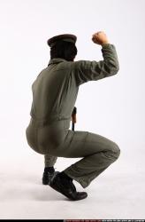 Man Adult Average Fighting with submachine gun Kneeling poses Army Asian
