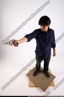 2011 11 LIAM STANDING AIMING REVOLVER2 01 A