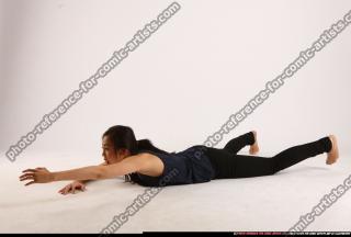 naomi-laying-reaching-for