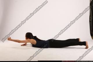 naomi-laying-reaching-for