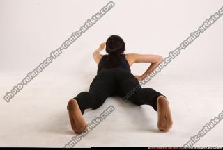 naomi-laying-reaching-for