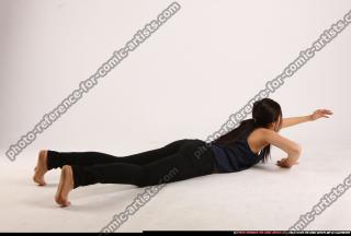 naomi-laying-reaching-for