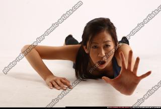 naomi-laying-reaching-for