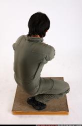 Man Adult Average Fighting with gun Kneeling poses Army Asian