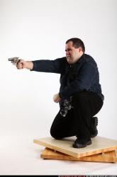 SLAVOJ KNEELING REVOLVER SHOOTING