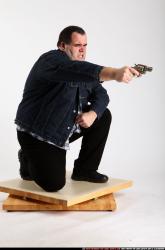SLAVOJ KNEELING REVOLVER SHOOTING