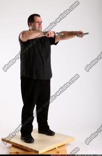 2012 02 SLAVOJ DUAL GUNS POSE1 01 B