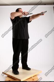 Slavoj-dual-guns-pose1