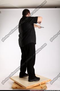Slavoj-dual-guns-pose1