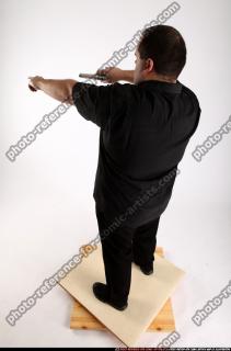 Slavoj-dual-guns-pose1