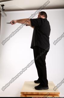 Slavoj-dual-guns-pose1