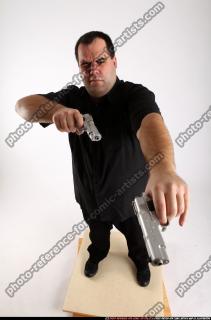 Slavoj-dual-guns-pose1