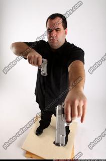Slavoj-dual-guns-pose1