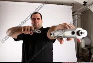 Slavoj-dual-guns-pose1