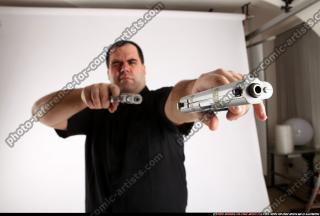 Slavoj-dual-guns-pose1