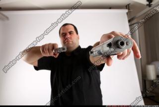 Slavoj-dual-guns-pose1