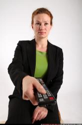 nadiya-sitting-tv-remote-control