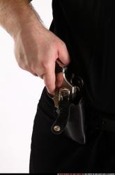 SLAVOJ DRAWING WEAPON FROM HOLSTER DETAIL