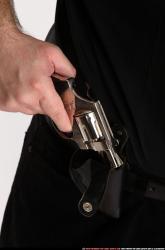 SLAVOJ DRAWING WEAPON FROM HOLSTER DETAIL