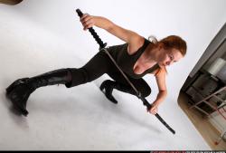 Woman Adult Athletic White Fighting with sword Kneeling poses Casual