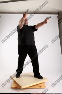 2012 06 SLAVOJ DUAL GUNS POSE4 01 C