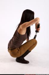 Woman Young Athletic Fighting with sword Kneeling poses Casual Asian
