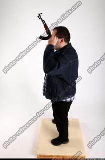 2012 08 SLAVOJ GUARDING POSE AK SUNGLASSES 02 A