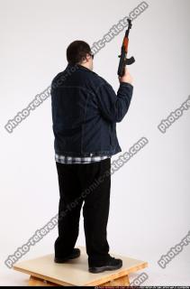 2012 08 SLAVOJ GUARDING POSE AK SUNGLASSES 05 B