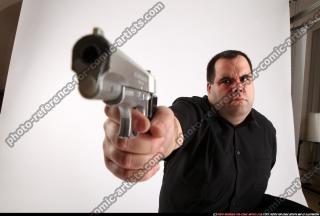 mobster-kneeling-aiming-pistol