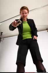 Woman Adult Average White Fighting with gun Standing poses Business