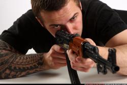 Man Adult Athletic White Fighting with submachine gun Laying poses Sportswear