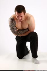 alex-kneeling-wounded