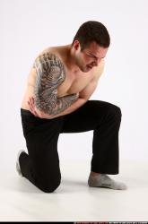 alex-kneeling-wounded