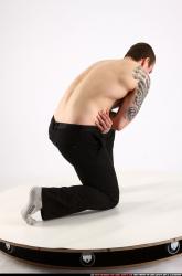 alex-kneeling-wounded