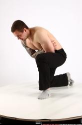 alex-kneeling-wounded