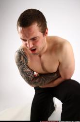 alex-kneeling-wounded