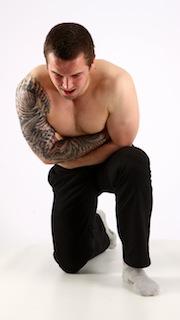 alex-kneeling-wounded