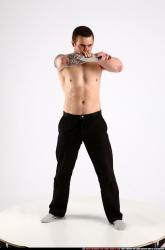 alex-standing-guarding-pose-knife