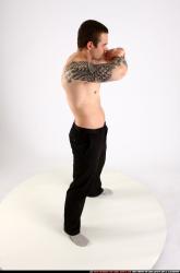 alex-standing-guarding-pose-knife