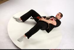 Man Adult Athletic White Fighting with submachine gun Laying poses Casual