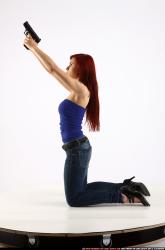 Woman Young Athletic White Fighting with gun Kneeling poses Casual